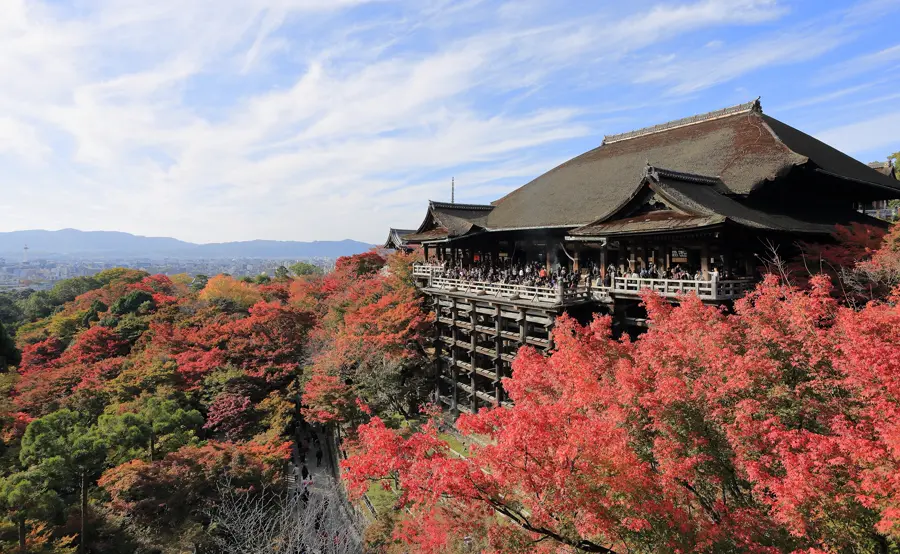 Kiyomizu-dera temple among red autumn trees