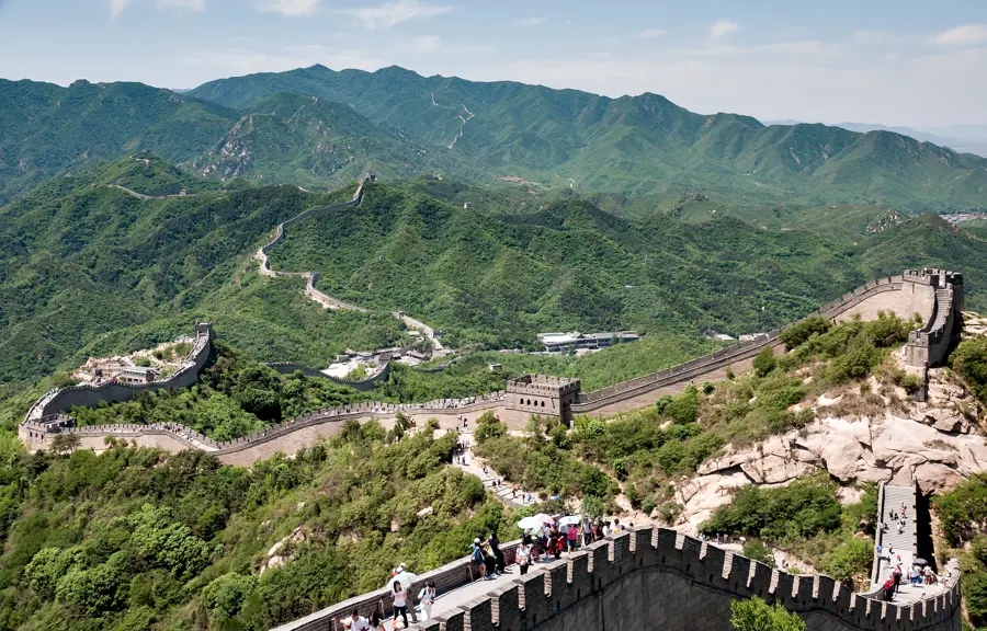 The Great Wall at Badaling winding over wooded hills