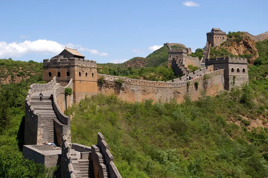 The Great Wall at Jinshanling runs over green mountains with its watchtowers