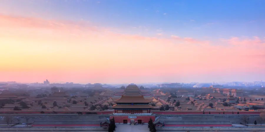 The roofs of the Forbidden City in Beijing in the evening haze